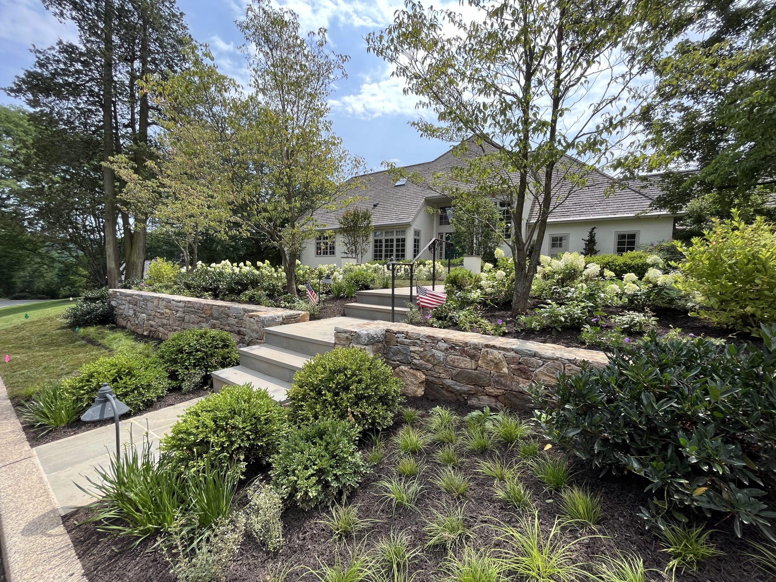 Beautiful house with lush garden landscape.