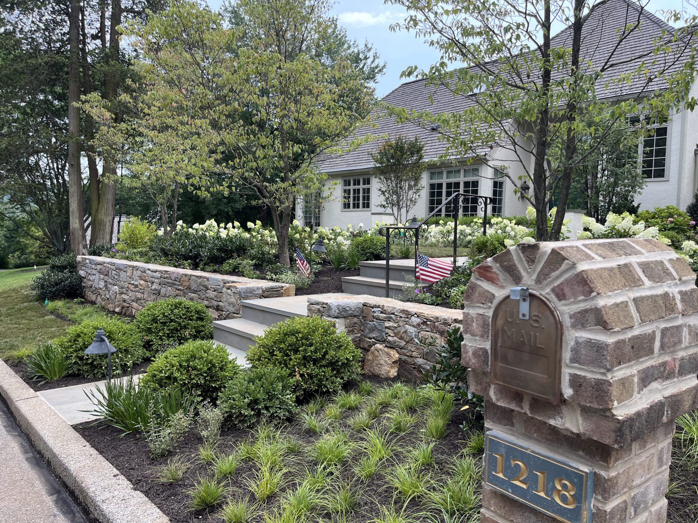 Beautiful house with garden and mailbox.