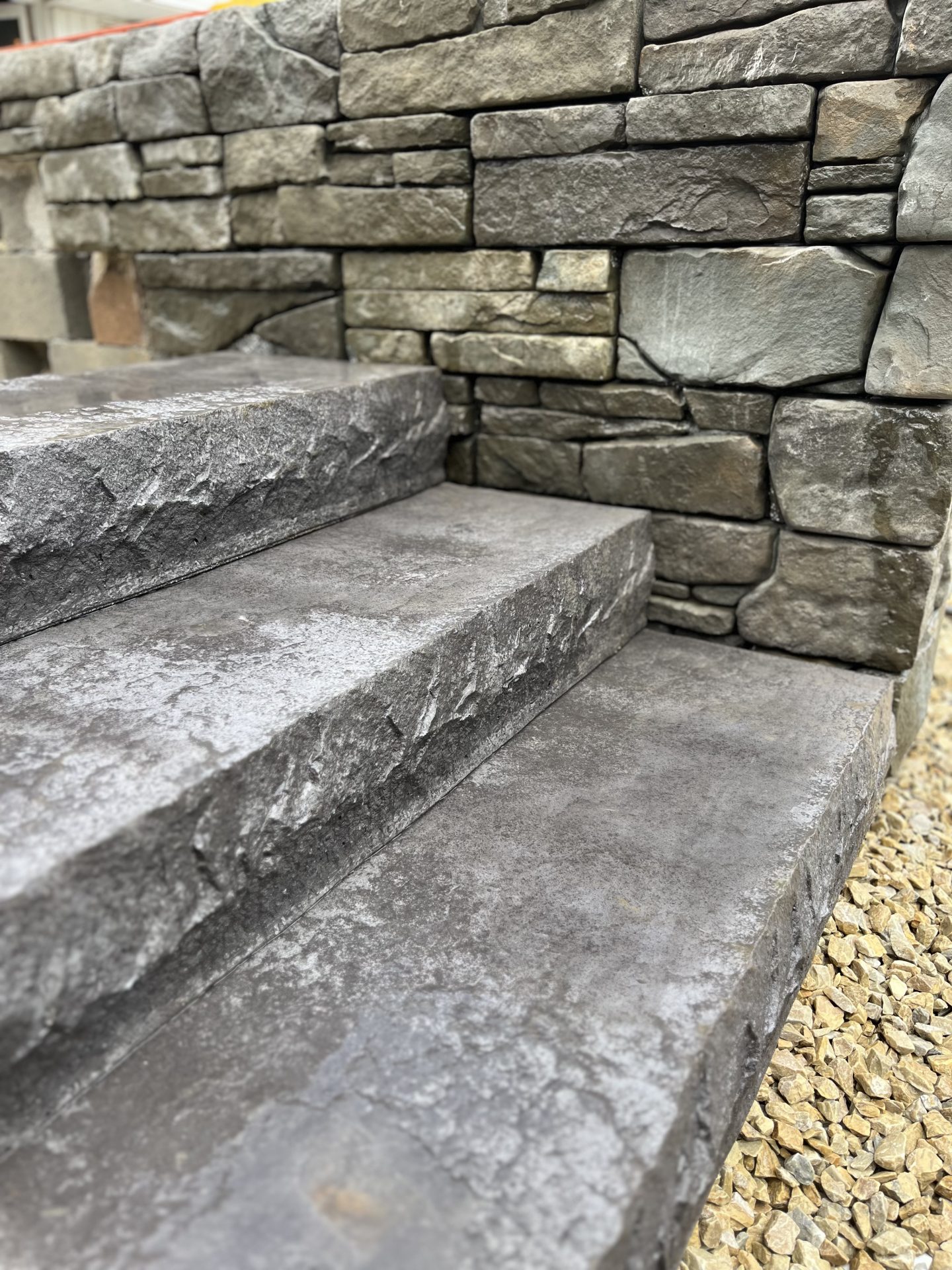 Stone steps and wall with gravel path