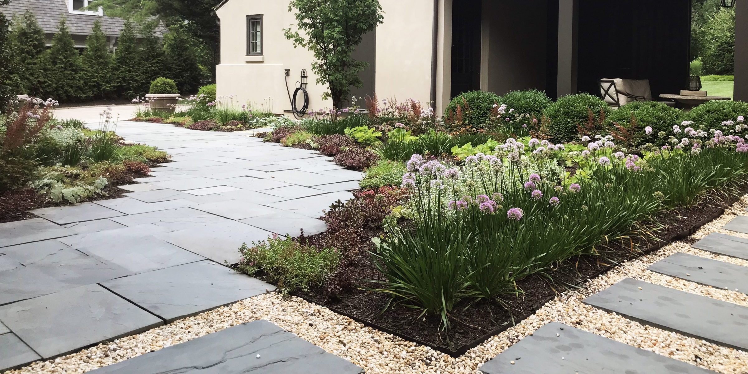 Beautiful garden with paved pathway and greenery